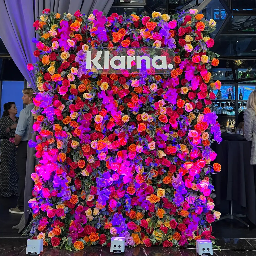 flower wall rental with uplighting